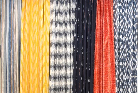 Hanging cotton curtain panels in stripes and ikat weaves