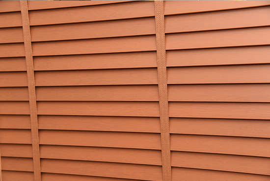 Terracotta-toned wooden blinds