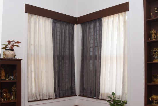 Grey and yellow semi-blackout curtains in a living room